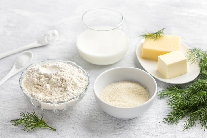 bowls filled with flour, grain, milk, and cheeses
