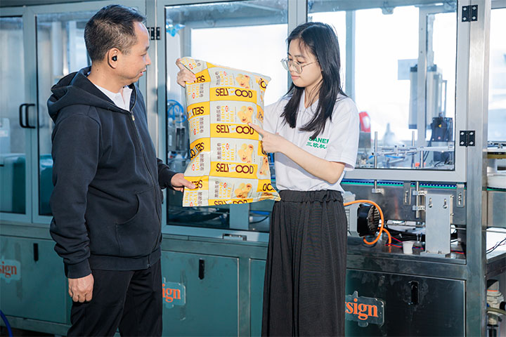 Saneu employee showing the technician a sealed package