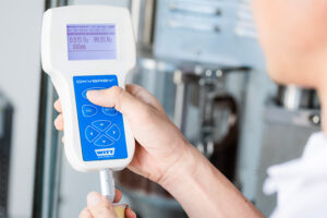 a technician checking the nitrogen content of each pod to ensure it meets 99.5%