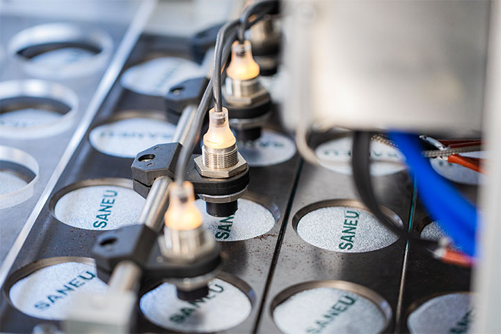 sensitive sensors inspect each filled pod to ensure they meet established standards