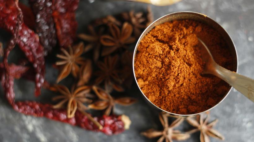 container filled with ground spices