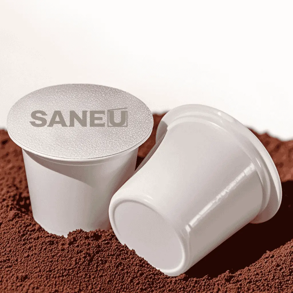 two SANEU K-cups over coffee grounds