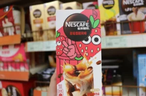 a box of nescafe coffee with stick pack beack seal single servings inside